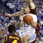 Kentucky's Isaiah Briscoe, middle, shoots between Arizona State's Gerry Blakes (4) and Eric Jacobsen during the second half of an NCAA college basketball game Saturday, Dec. 12, 2015, in Lexington, Ky. Kentucky won 72-58. (AP Photo/James Crisp)