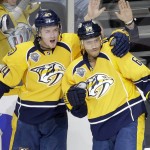 Nashville Predators center Mike Ribeiro (63) is congratulated by Colton Sissons (84) after Ribeiro scored a goal against the Arizona Coyotes in the third period of an NHL hockey game, Tuesday, Dec. 1, 2015, in Nashville, Tenn. (AP Photo/Mark Humphrey)