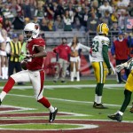 Arizona Cardinals wide receiver John Brown (12) scores a touchdown against the Green Bay Packers during the first half of an NFL football game, Sunday, Dec. 27, 2015, in Glendale, Ariz. (AP Photo/Rick Scuteri)