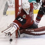 Arizona Coyotes' Anders Lindback, of Sweden, makes a save on a shot by the Carolina Hurricanes during the first period of an NHL hockey game Saturday, Dec. 12, 2015 in Glendale, Ariz. (AP Photo/Ross D. Franklin)
