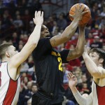 Arizona State forward Willie Atwood shoots over UNLV forward Ben Carter, left, and UNLV forward Stephen Zimmerman Jr. during the first half of an NCAA college basketball game Wednesday, Dec. 16, 2015, in Las Vegas. (AP Photo/John Locher)