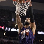 Phoenix Suns center Tyson Chandler dunks during the first half of an NBA basketball game against the San Antonio Spurs, Wednesday, Dec. 30, 2015, in San Antonio. (AP Photo/Darren Abate)