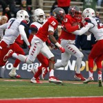 New Mexico quarterback Lamar Jordan (13) pushes his way to the end zone against the defense of Arizona cornerback Jarvis McCall Jr. (29) during the first half of the New Mexico Bowl NCAA college football game in Albuquerque, N.M., Saturday, Dec. 19, 2015. (AP Photo/Andres Leighton)