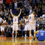 Orlando Magic forward Evan Fournier (10) sits on the floor after missing a three-point attempt as time expires during the second half of an NBA basketball game against the Phoenix Suns, Wednesday, Dec. 9, 2015, in Phoenix. The Suns won 107-104. (AP Photo/Matt York)