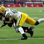 Arizona Cardinals running back David Johnson (31) is stopped at the goal line by Green Bay Packers strong safety Morgan Burnett (42) during the first half of an NFL football game, Sunday, Dec. 27, 2015, in Glendale, Ariz. (AP Photo/Ross D. Franklin)