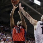 Arizona's Allonzo Trier, left, shoots against Gonzaga's Domantas Sabonis, right,  during the second half of an NCAA college basketball game, Saturday, Dec. 5, 2015, in Spokane, Wash. Arizona won 68-63. (AP Photo/Young Kwak)