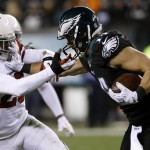 Philadelphia Eagles' Riley Cooper, right, tries to break away from Arizona Cardinals' Jerraud Powers during the second half of an NFL football game, Sunday, Dec. 20, 2015, in Philadelphia. (AP Photo/Michael Perez)