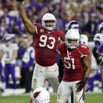 Arizona Cardinals defensive end Calais Campbell (93) holds up the football after a fumble recovery for the win against the Minnesota Vikings during the second half of an NFL football game, Thursday, Dec. 10, 2015, in Glendale, Ariz. The Cardinals won 23-20. (AP Photo/Rick Scuteri)