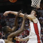 UNLV forward Stephen Zimmerman Jr., right, blocks a shot by Arizona State guard Gerry Blakes during the first half of an NCAA college basketball game Wednesday, Dec. 16, 2015, in Las Vegas. (AP Photo/John Locher)