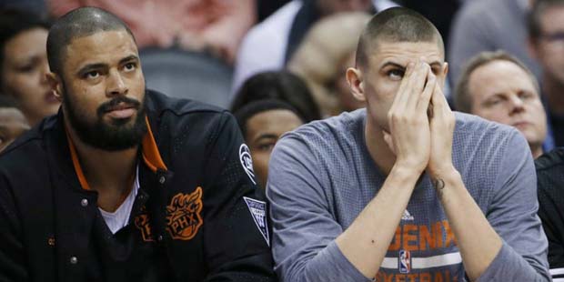 Phoenix Suns' Tyson Chandler, Alex Len, and T.J. Warren, from left, on the bench during the second ...