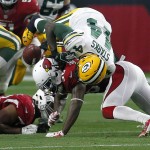 Arizona Cardinals defensive back D.J. Swearinger (36), bottom, forces Green Bay Packers running back James Starks (44) to fumble during the second half of an NFL football game, Sunday, Dec. 27, 2015, in Glendale, Ariz. (AP Photo/Rick Scuteri)