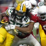 Green Bay Packers running back Eddie Lacy (27) is tackled by Arizona Cardinals defensive end Calais Campbell (93) during the first half of an NFL football game, Sunday, Dec. 27, 2015, in Glendale, Ariz. (AP Photo/Ross D. Franklin)