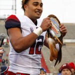 Arizona quarterback Anu Solomon holds up the Offensive Player of the Game award after the New Mexico Bowl NCAA college football game against New Mexico in Albuquerque, N.M., Saturday, Dec. 19, 2015. Arizona won 45-37. (AP Photo/Andres Leighton)