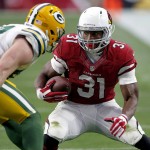 Arizona Cardinals running back David Johnson (31) tries to elude Green Bay Packers outside linebacker Jake Ryan (47) during the first half of an NFL football game, Sunday, Dec. 27, 2015, in Glendale, Ariz. (AP Photo/Ross D. Franklin)