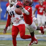 New Mexico wide receiver Dameon Gamblin, right, comes up short for a catch as he's defended by Arizona safety Will Parks, left,  during the second half of the New Mexico Bowl NCAA college football game in Albuquerque, N.M., Saturday, Dec. 19, 2015. Arizona won 45-37. (AP Photo/Andres Leighton)