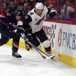Carolina Hurricanes' Eric Staal (12) battles with Arizona Coyotes' Martin Hanzal (11) during the first period of an NHL hockey game, Sunday, Dec. 6, 2015, in Raleigh, N.C. The Hurricanes won 5-4. (AP Photo/Karl B DeBlaker)