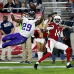 Minnesota Vikings cornerback Xavier Rhodes (29) breaks up a pass intended for Arizona Cardinals wide receiver J.J. Nelson (14) during the second half of an NFL football game, Thursday, Dec. 10, 2015, in Glendale, Ariz. (AP Photo/Ross D. Franklin)
