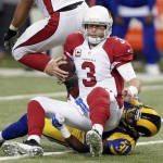Arizona Cardinals quarterback Carson Palmer (3) is sacked for a 9-yard loss by St. Louis Rams strong safety Maurice Alexander during the second quarter of an NFL football game on Sunday, Dec. 6, 2015, in St. Louis. (AP Photo/Tom Gannam)