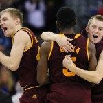 Arizona State players, Austin Witherill, right, Obinna Oleka (5) and Kodi Justice, left, celebrate their 79-77 win over Creighton in an NCAA college basketball game in Omaha, Neb., Wednesday, Dec. 2, 2015. (AP Photo/Nati Harnik)