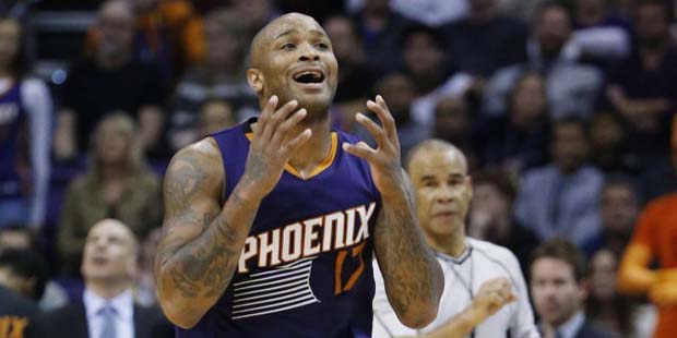 Phoenix Suns' P.J. Tucker shouts after being called for a foul during the second half of an NBA bas...