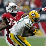 Green Bay Packers wide receiver Davante Adams (17) makes the catch as Arizona Cardinals cornerback Patrick Peterson (21) defends during the first half of an NFL football game, Sunday, Dec. 27, 2015, in Glendale, Ariz. (AP Photo/Rick Scuteri)