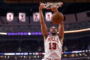Chicago Bulls center Joakim Noah dunks the ball during the first half of an NBA basketball game against the Detroit Pistons, Friday, Dec. 18, 2015, in Chicago. (AP Photo/Charles Rex Arbogast)