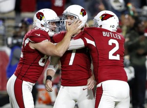 FILE - In this Nov. 22, 2015 file photo, Arizona Cardinals kicker Chandler Catanzaro (7) celebrates his game-winning field goal with punter Drew Butler (2) and snapper Mike Leach (82) against the Cincinnati Bengals during the second half of an NFL football game in Glendale, Ariz. The Cardinals won 34-31. (AP Photo/Ross D. Franklin, File)