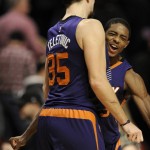 Phoenix Suns' Brandon Knight (3), and Mirza Teletovic (35), of Bosnia & Herzegovina, celebrate after defeating the Chicago Bulls 103-101 during a basketball game Monday, Dec. 7, 2015, in Chicago. (AP Photo/Paul Beaty)