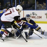 Arizona Coyotes' Steve Downie (17) scores past St. Louis Blues goalie Jake Allen, right, and Alex Pietrangelo, left, during the first period of an NHL hockey game Tuesday, Dec. 8, 2015, in St. Louis. (AP Photo/Jeff Roberson)