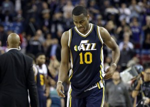 Utah Jazz guard Alec Burks walks off the court after the Jazz lost to the Sacramento Kings 114-106 in an NBA basketball game in Sacramento, Calif., Tuesday, Dec. 8, 2015.(AP Photo/Rich Pedroncelli)