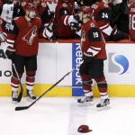 Arizona Coyotes' Shane Doan (19) gets a high-five from teammate Mikkel Boedker (89), after Doan's hat trick, during the period of an NHL hockey game against the Chicago Blackhawks Tuesday, Dec. 29, 2015, in Glendale, Ariz. The Blackhawks won 7-5. (AP Photo/Ross D. Franklin)