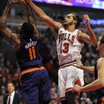 Chicago Bulls' Joakim Noah (13), battles Phoenix Suns' Markieff Morris (11), for a rebound during the first half of a basketball game Monday, Dec. 7, 2015, in Chicago. (AP Photo/Paul Beaty)