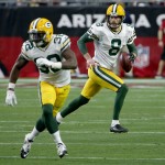 Green Bay Packers punter Tim Masthay (8) runs the football after a fake punt as cornerback Chris Banjo (32) defends during the first half of an NFL football game against the Arizona Cardinals, Sunday, Dec. 27, 2015, in Glendale, Ariz. (AP Photo/Ross D. Franklin)