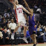 Detroit Pistons guard Steve Blake (22) shoots as Phoenix Suns guard Ronnie Price defends during the first half of an NBA basketball game, Wednesday, Dec. 2, 2015, in Auburn Hills, Mich. (AP Photo/Carlos Osorio)