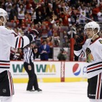 Chicago Blackhawks' Artemi Panarin (72) celebrates his goal against the Arizona Coyotes with Artem Anisimov (15) during the first period of an NHL hockey game Tuesday, Dec. 29, 2015, in Glendale, Ariz. (AP Photo/Ross D. Franklin)