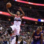 Washington Wizards guard Ramon Sessions (7) goes to the basket past Phoenix Suns guard Brandon Knight (3) during the second half of an NBA basketball game, Friday, Dec. 4, 2015, in Washington. The Wizards won 109-106. (AP Photo/Nick Wass)