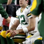 Green Bay Packers quarterback Aaron Rodgers (12) sits on the bench during the second half of an NFL football game against the Arizona Cardinals, Sunday, Dec. 27, 2015, in Glendale, Ariz. (AP Photo/Ross D. Franklin)