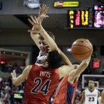 Arizona's Elliott Pitts, front, goes after a rebound against Gonzaga's Kyle Wiltjer, behind, during the second half of an NCAA college basketball game, Saturday, Dec. 5, 2015, in Spokane, Wash. Arizona won 68-63. (AP Photo/Young Kwak)