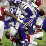 Arizona Cardinals inside linebacker Dwight Freeney (54) forces Minnesota Vikings quarterback Teddy Bridgewater (5) to fumble during the second half of an NFL football game, Thursday, Dec. 10, 2015, in Glendale, Ariz. The Cardinals recovered the ball to secure the 23-20 win. (AP Photo/Rick Scuteri)
