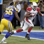 Arizona Cardinals running back David Johnson, right, catches a 10-yard pass for a touchdown as St. Louis Rams linebacker Akeem Ayers defends during the third quarter of an NFL football game on Sunday, Dec. 6, 2015, in St. Louis. (AP Photo/Tom Gannam)