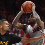 Arizona guard Kadeem Allen (5) right, moves around Long Beach State guard A.J. Spencer during the first half of an NCAA college basketball game Tuesday, Dec. 22, 2015, in Tucson, Aria. (Kelly Presnell/Arizona Daily Star via AP)