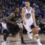 Golden State Warriors' Stephen Curry drives the ball past Phoenix Suns' Eric Bledsoe (2) during the first half of an NBA basketball game Wednesday, Dec. 16, 2015, in Oakland, Calif. (AP Photo/Ben Margot)