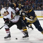 Arizona Coyotes right winger Steve Downie, left, competes for the puck with Buffalo Sabres left winger Marcus Foligno (82) during the second period of an NHL hockey game Friday Dec. 4, 2015 in Buffalo, N.Y. (AP Photo/Gary Wiepert)