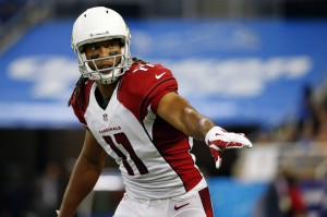 FILE - In this Oct. 11, 2015, file photo, Arizona Cardinals wide receiver Larry Fitzgerald (11) waits on the snap during the second half of an NFL football game against the Detroit Lions in Detroit. Blocking became a bigger focus for Fitzgerald after Bruce Arians was hired and shifted him from wideout to the slot. Fitzgerald wasn't thrilled with the move, but he's got no complaints now, especially after landing a new two-year, $22 million contract, all of it guaranteed. (AP Photo/Paul Sancya, File)