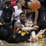 Arizona State guard Kodi Justice (44) passes from the floor in front of UNLV guard Ike Nwamu during the second half of an NCAA college basketball game Wednesday, Dec. 16, 2015, in Las Vegas. Arizona State won 66-56. (AP Photo/John Locher)
