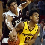 Texas A&M center Tyler Davis, tries to steal the ball from Arizona State guard Tra Holder (0) during the second half of an NCAA college basketball game, Saturday, Dec. 5, 2015, in Tempe, Ariz. (AP Photo/Rick Scuteri)