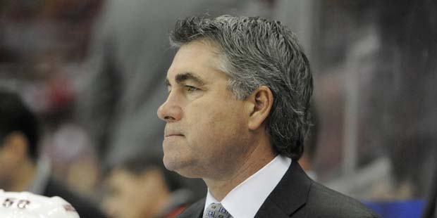 Arizona Coyotes head coach Dave Tippett watches his team play the Detroit Red Wings during the seco...