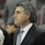Arizona Coyotes head coach Dave Tippett watches his team play the Detroit Red Wings during the second period of an NHL hockey game in Detroit, Thursday, Dec. 3, 2015.  (AP Photo/Jose Juarez)