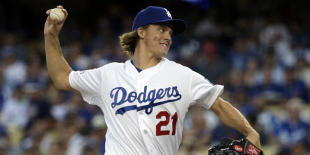Los Angeles Dodgers starting pitcher Zack Greinke throws to the New York Mets during the first inni...
