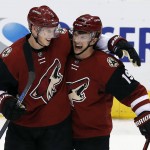 Arizona Coyotes defenseman Connor Murphy and Shane Doan (19) celebrate the Coyotes defeated the Winnipeg Jets 5-2 during an NHL hockey game, Thursday, Dec. 31, 2015, in Glendale, Ariz. The Coyotes won 4-2. (AP Photo/Rick Scuteri)